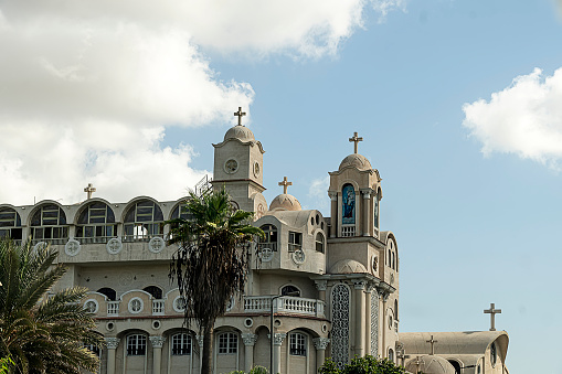 A church with domes against the blue sky. Alexandria Egypt.
