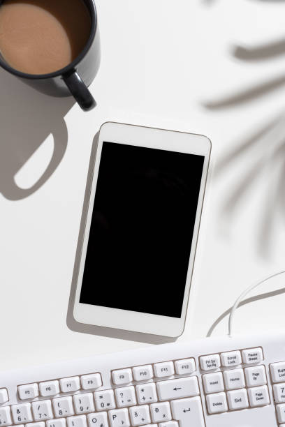istock Mobile Phone Screen With Important Messages On Desk With Coffee And Keyboard. Crutial Information On Cellphone On Table With Cup. Late Updates Presented. 1412088775