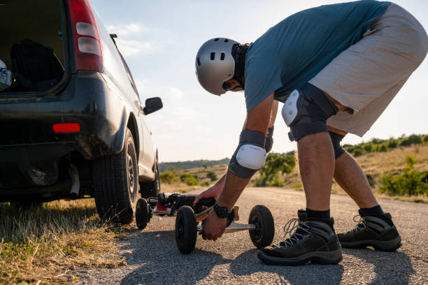 istock Man tries his electric mountainboard at sunset. 1412089779