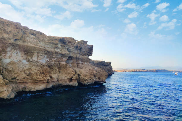 istock Beautiful seascape with steep cliffs blue water 1412092530