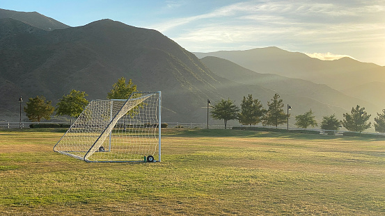 A goal post stands at the ready in Southern California. Soon the team will arrive and play will begin. In the meantime, a pleasant scene plays out.