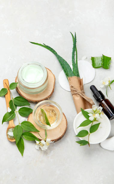 istock Aloe vera slices and moisturizer on a light background. 1412132126