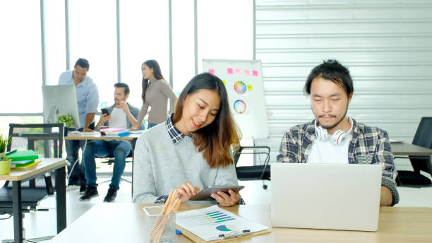 istock Creative team discussing about work at office, Small business teamwork planing business strategy, office life 1412133102