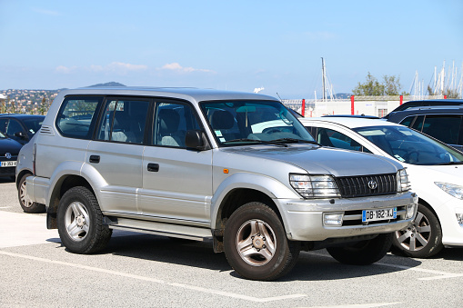 Saint-Tropez, France - September 11, 2019: Grey 4x4 vehicle Toyota Land Cruiser Prado 95 in the city street.