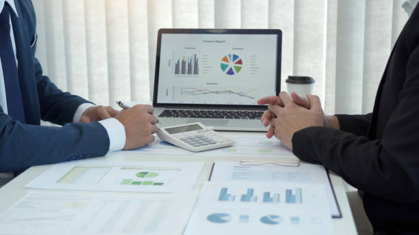 istock Teamwork with business people analysis cost graph on desk at meeting room. 1412136174