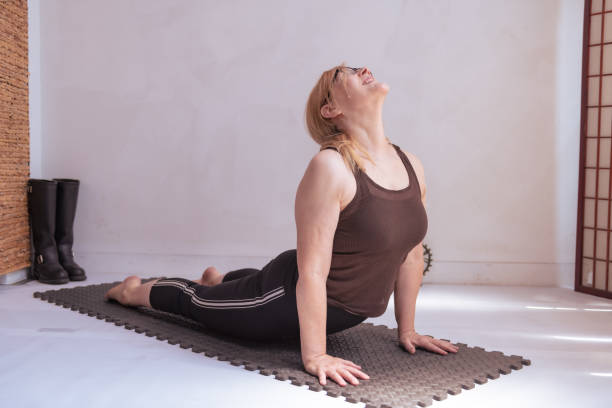 istock Middle aged yogini practices yoga alone in a downtown Los Angeles studio. 1412136439