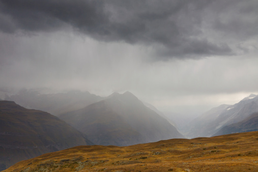 Heavy rain pouring down in the Swiss Alps.