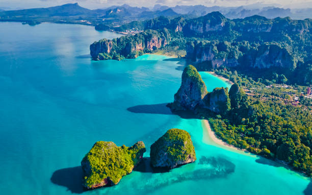 Aerial drone view of Railay beach Krabi Thailand Aerial drone view of Railay beach Krabi Thailand. Railay beach with limestone rocks from the sky krabi province stock pictures, royalty-free photos & images