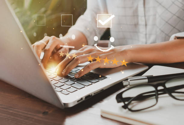 istock User give rating to service experience on online application. 5-star rating very impressed. Customer service and Satisfaction concept 1412139903
