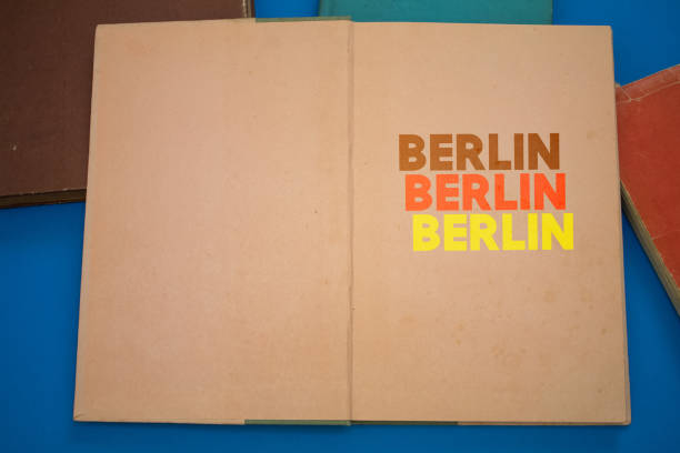 istock Berlin word in opened book with vintage, natural patterns old antique paper design. 1412144057