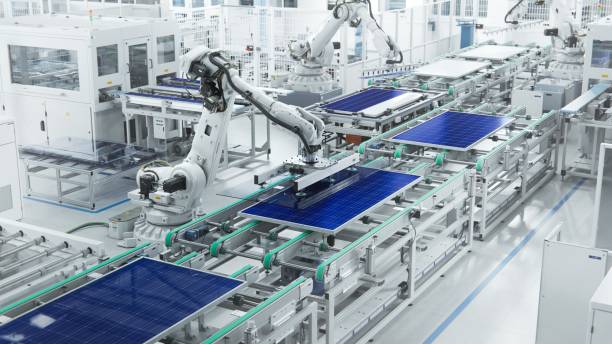 Wide Shot of Solar Panel Production Line with Robot Arms at Modern Bright Factory. Solar Panels are being Assembled on Conveyor. Solar Panel Production Line at Modern Bright Factory. Solar Panels are being Assembled on Conveyor solar panel manufacturing stock pictures, royalty-free photos & images
