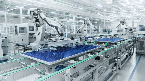Wide Shot of Solar Panel Production Line with Robot Arms at Modern Bright Factory. Solar Panels are being Assembled on Conveyor. Wide Shot of Solar Panel Production Line with Robot Arms at Modern Bright Factory. Solar Panels are being Assembled on Conveyor. wide shot stock pictures, royalty-free photos & images