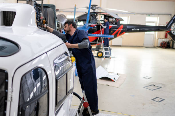 istock Male mechanic checking helicopter 1412148340