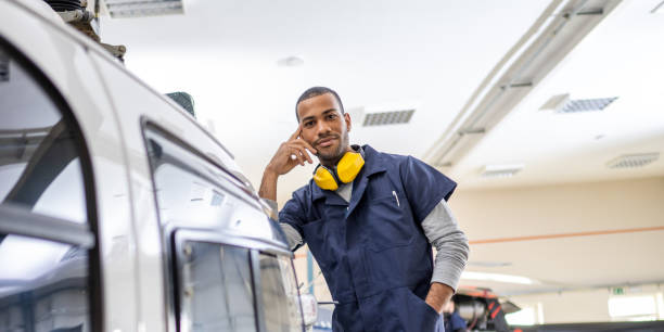 istock Male mechanic standing in hangar 1412148343