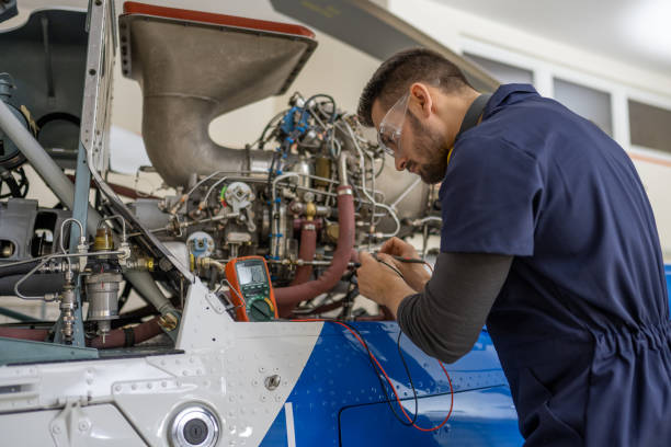istock Mechanic repairing helicopter engine 1412148401