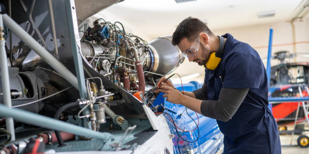 istock Mechanic repairing helicopter engine 1412148402