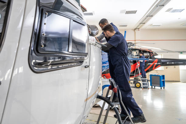 istock Mechanics repairing helicopter engine 1412148853