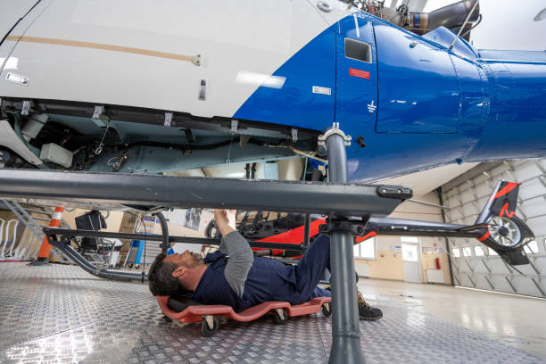 istock Mechanic repairing helicopter engine 1412148867