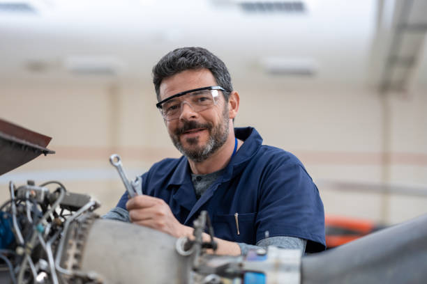 Mechanic repairing helicopter engine