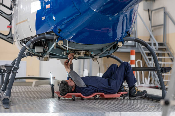 istock Mechanic repairing helicopter engine 1412148902