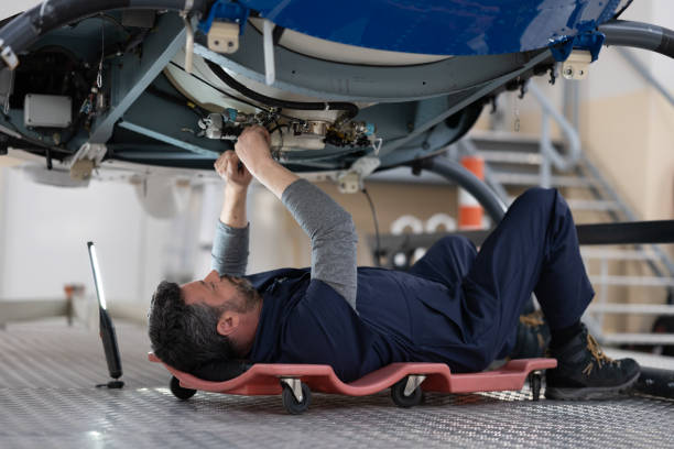 istock Mechanic repairing helicopter engine 1412148908