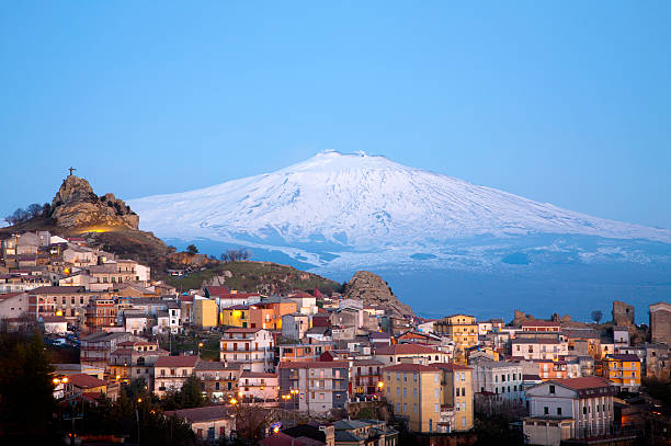 Etna Volcano View of the village of San Teodoro and Etna volcano on background. Sicily, Italy. sicily photos stock pictures, royalty-free photos & images