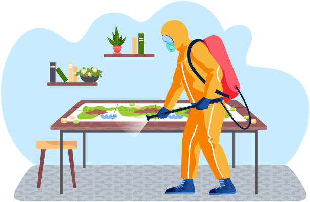 A man from epidemiological service doing disinfection in livingroom to kill viruses and bacteria A man from epidemiological service doing disinfection livingroom with board game on the table to kill viruses and bacteria. Male character in a protective suit sprays a room with disinfectant solute office fogging stock illustrations
