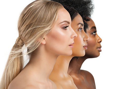 Beauty Diversity Faces. Multi Ethnic Women Caucasian, African and Asian. Three Woman Profile with different Skin Type and Color over White Isolated Studio Background. Facial Care Cosmetics and Make up