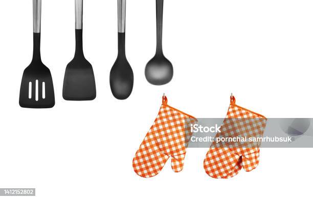 Orange Heat Resistant Cooking Gloves With Kitchen Utensils On White Background Stock Photo - Download Image Now