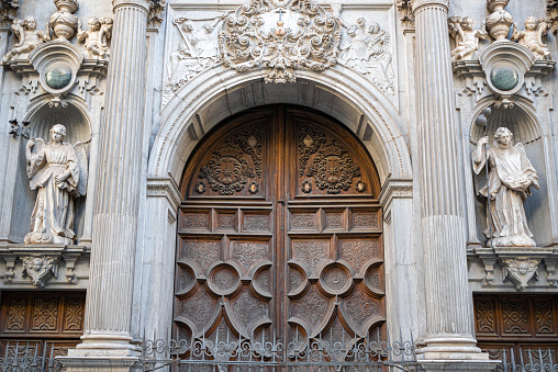 Door guarded by angels in the Basilica of San Juan de Dios in Granada, Spain