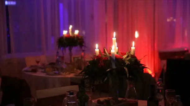 Lighting A Candle With A Match To Get A Romantic Candlelight. Amazing andles and candlesticks are on the table. Stay lights with the peaceful background of religious ceremony HD