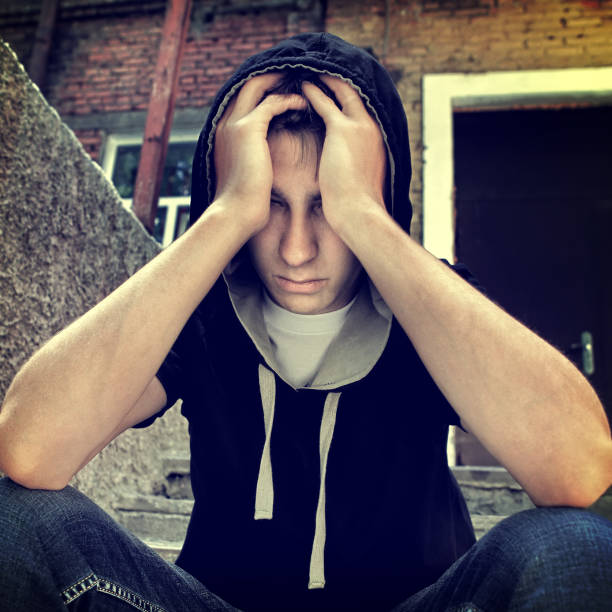 istock Sad Young Man outdoor 1412157887