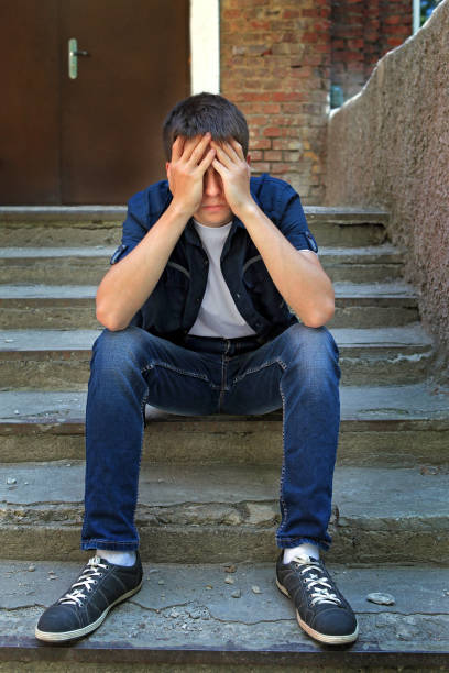 istock Sad Young Man outdoor 1412157937