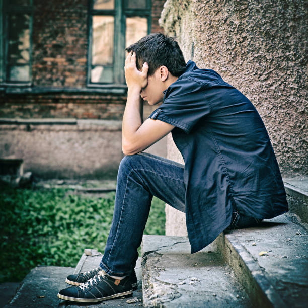istock Sad Teenager outdoor 1412158076