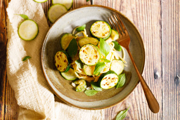 istock Healthy spaghetti pasta with roasted zucchini and cheese. 1412158790