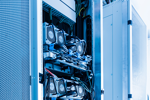 A row of racks with energy supply UPS hardware inside server room