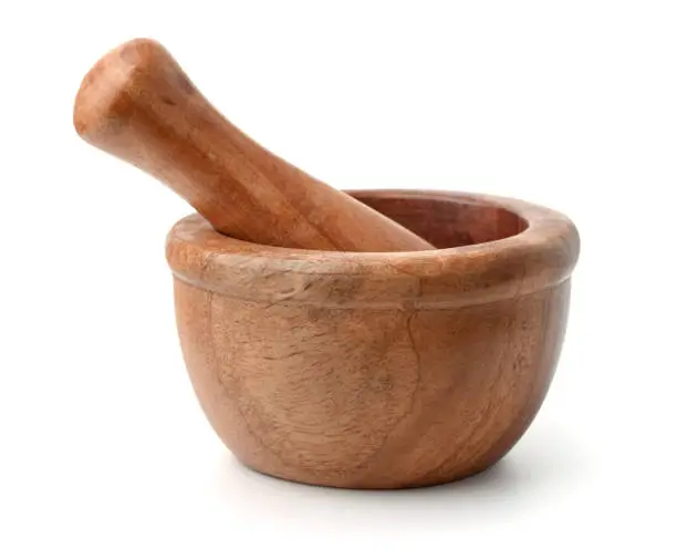 Wooden mortar and pestle isolated on white