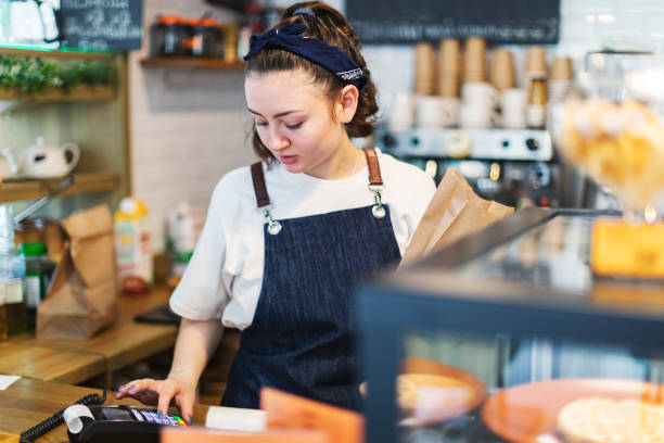 istock Barista using point-of-sale terminal 1412162181