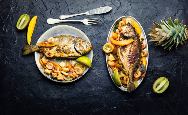 istock Baked fish with pineapple, mango and kiwi. 1412162343