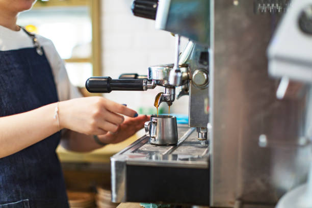 istock Barista making coffee with coffee machine at the cafe 1412163426