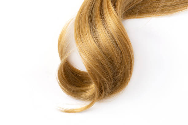istock Long blond curly hair on white background. 1412167660