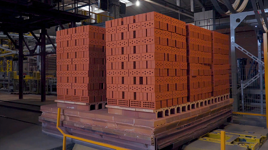 Loading brick in cart in the brick factory.