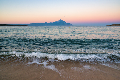 Wave in the sea, landscape with Mount Athos in the background in Greece