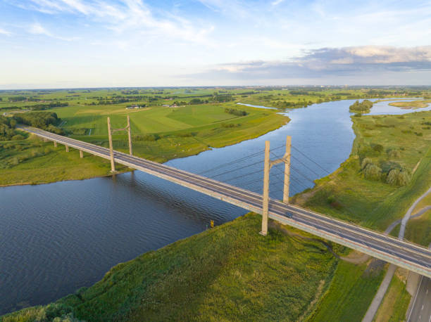 istock Suspension bridge over the river IJssel 1412175062