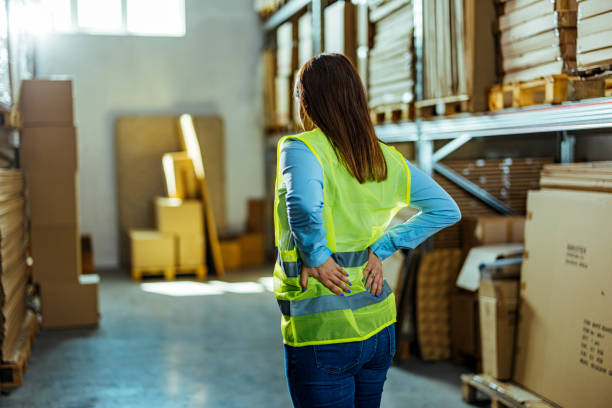 istock Tired and overworked delivery female worker experiencing a back pain 1412175554