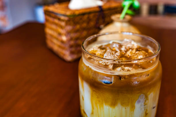 A cup of milk iced coffee, iced caramel latte A cup of milk iced coffee, iced caramel latte cafe macchiato stock pictures, royalty-free photos & images