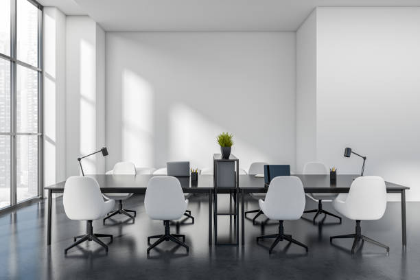 istock Office interior with laptop on desk, panoramic window on city view 1412176368
