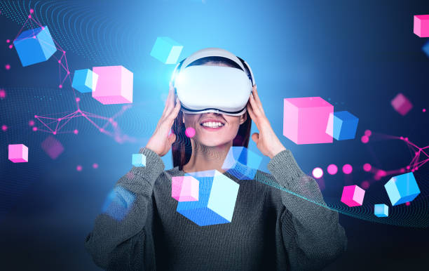 istock Woman in vr headset, blocks in cyberspace. Metaverse and virtual reality 1412176397