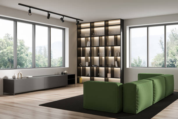 istock Light living room interior with couch and shelf with decoration, panoramic window 1412178239