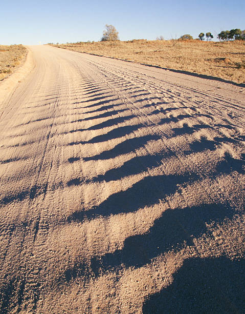 rought road - country road australia road corrugated cardboard stock-fotos und bilder